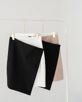 TIANA – Two-Tone Asymmetric Skirt in Black & Beige